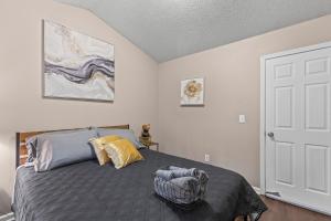 a bedroom with a bed and a white door at Stockbridge South of Atlanta - Private Room 2 in Stockbridge