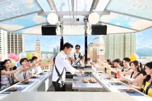 a waiter serving food at a buffet line at City of Dreams - Morpheus in Macau +48 photos