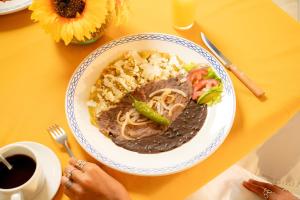 a plate of food on a yellow table at Hacienda de Jalpan in Jalpan