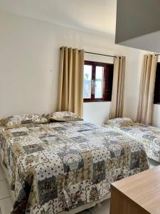 Ένα ή περισσότερα κρεβάτια σε δωμάτιο στο Casa Nossa