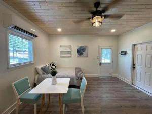 a living room with a couch and a table at Beautifully Renovated Studio 2 Miles From Marina! in Winchester