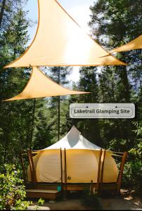 a tent is set up under a canopy at Smith Lake Farm in Merville
