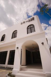 a white building with a sign on top of it at GOtoBED in Mutiara Airport +19 photos