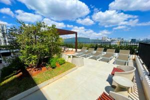 a group of chairs sitting on top of a building at BSide Faria Lima Pinheiros in Sao Paulo