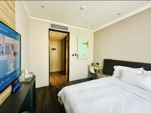 Postel nebo postele na pokoji v ubytování Hanting Hotel Beijing Shangdi Anningzhuang