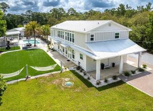 an aerial view of a house with a large yard at The Retreat at Santa Rosa Beach Bungalow C in Destin
