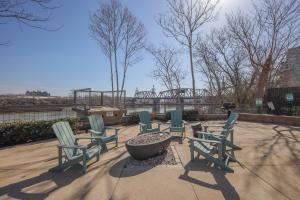 a group of chairs sitting around a fire pit at Riverfront Retreat-Near Broadway, Pool, Park Free in Nashville