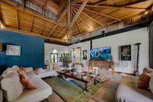 Et opholdsområde på Villa Balinaise dans son écrin tropical