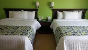Voodi või voodid majutusasutuse HG Hotel toas