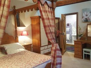 Postel nebo postele na pokoji v ubytování Lily Rose Cottage + 17 fotografií