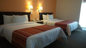 Voodi või voodid majutusasutuse HG Hotel toas