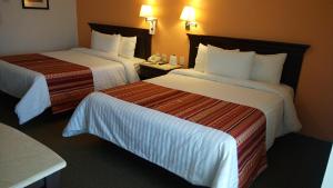 Voodi või voodid majutusasutuse HG Hotel toas