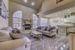 a living room with two couches and a fireplace at Pocono Retreat -1 Mile To Lake And Skiing! in Lake Harmony