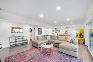 a living room with a couch and a table at 4BR Hilltop Villa by Universal Studios with Pool and Amazing Views in Los Angeles