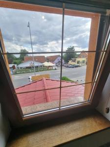 a window with a view of a street at Apartament Złota Rybka Stegna in Stegna