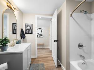 a bathroom with a white sink and a shower at Arts District Walk to Restaurants, Bars Sleeps 8 -Tillman in Cleveland +139 photos