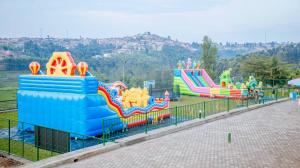 a playground with many different types of slides at Hotel saint andre kabgayi in Gitarama