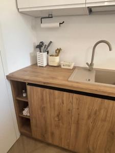 a kitchen counter with a sink and some utensils at Apartament u Moni in Krajno Pierwsze +55 photos
