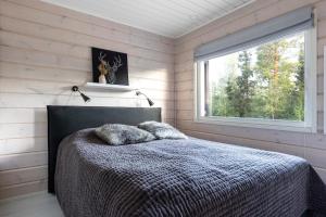 Giường trong phòng chung tại Modern house ski-in-out