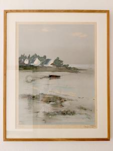 a framed painting of a beach with houses at Maison charmante - 10 min de Paris in Montreuil