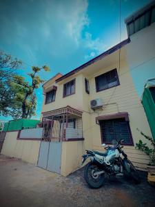 a motorcycle parked in front of a house at Swaransh villa in Lonavala