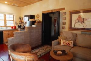 a living room with a couch and a table at Stay Old Town Road in Albuquerque