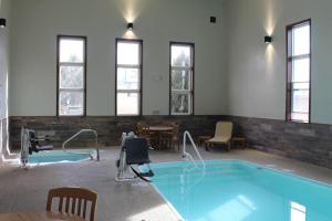 a pool in a waiting room with chairs and a table at Quality Inn Spearfish I-90 in Spearfish