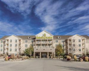 a hotel with a sign on the front of it at MainStay Suites Casper in Casper