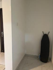a black object sitting on the corner of a wall at MANAZEL ladies and Family stay only corniche in Khor Fakkan +2 photos