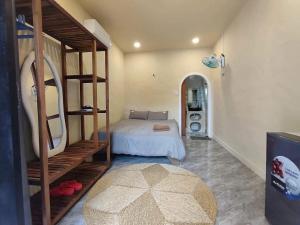 a bedroom with a bunk bed and a room with a mirror at Nắng Vĩnh Hy in Ninh Hải