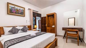 Postel nebo postele na pokoji v ubytování Teba Kauh Ubud