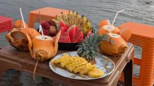 a table with a plate of fruit on a table at Serendib Villa in Negombo +40 photos