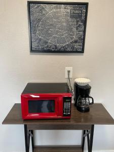 a red microwave sitting on top of a table at Studio Wbalcony-nob Hill, Unmh, Pres Hosp in Albuquerque +7 photos