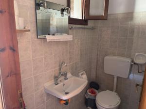 a bathroom with a sink and a toilet at Matina's house in Samos +47 photos