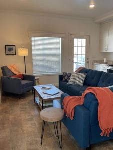 a living room with a blue couch and a table at Beautiful Rental Just North Of Durango in Hermosa
