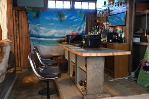 a bar with a table and two chairs in a room at Kikubari - Vacation STAY 88953v in Isumi