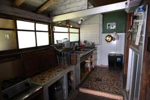a kitchen with a sink and a refrigerator at Kikubari - Vacation STAY 88953v in Isumi +11 photos