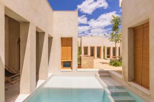 an external view of a house with a swimming pool at Casa Jar in Jarafuel