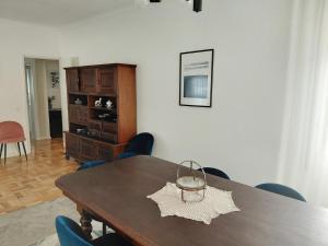 a dining room with a wooden table and chairs at Correia Villa in Barcelos