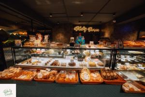 a bakery filled with lots of different types of pastries at Amarjeet Hotel in Kurseong +14 photos