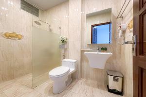 a bathroom with a toilet and a sink and a shower at Eva Adam Hotel in Ho Chi Minh City +19 photos