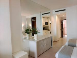 a living room with two vases on a counter at BH Cura marina 2 in Mogán