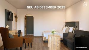 a hotel room with a bed and a couch at Pension Kohler in Fügen +6 photos