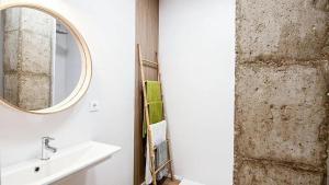 a bathroom with a sink and a mirror at LUXURY APARTMENT SCIENCES CITY Valencia B in Valencia