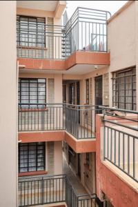 an external view of an apartment building with balconies at NOVA Stays, Luxe 1BR apartment, South B in Nairobi