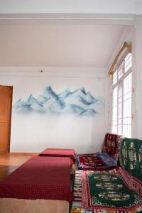 Postel nebo postele na pokoji v ubytování Aavya backpackers hostel