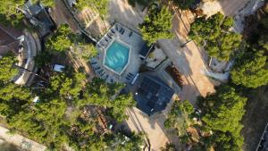 an overhead view of a building with a swimming pool at Taber Pašman – Mobile Homes in Pašman +39 photos