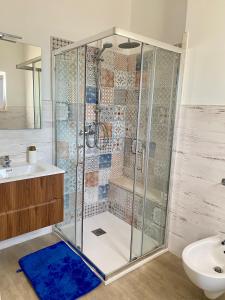 a bathroom with a shower with a toilet and a sink at Il Belvedere di Babbo in Fasano +42 photos
