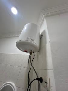 a white light on the corner of a wall at Hôtel Charles in Brazzaville