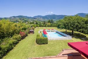 an aerial view of a garden with a swimming pool at Villa al Falchetto by VacaVilla in Capannori